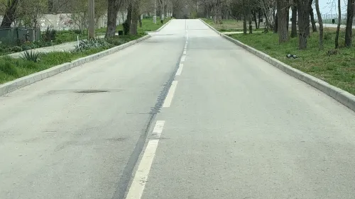 Новости » Общество: Асфальт на ул.Черноморской восстановили