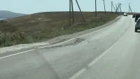 Новости » Общество: По дороге в Курортное на новом асфальте появились ямы