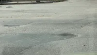 На Шлагбаумской дорога сильно просела в двух местах